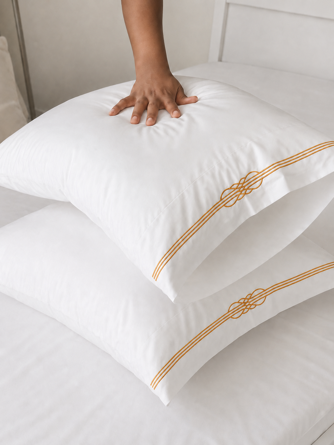 Four white pillowcases included in the 600TC king bedsheet set